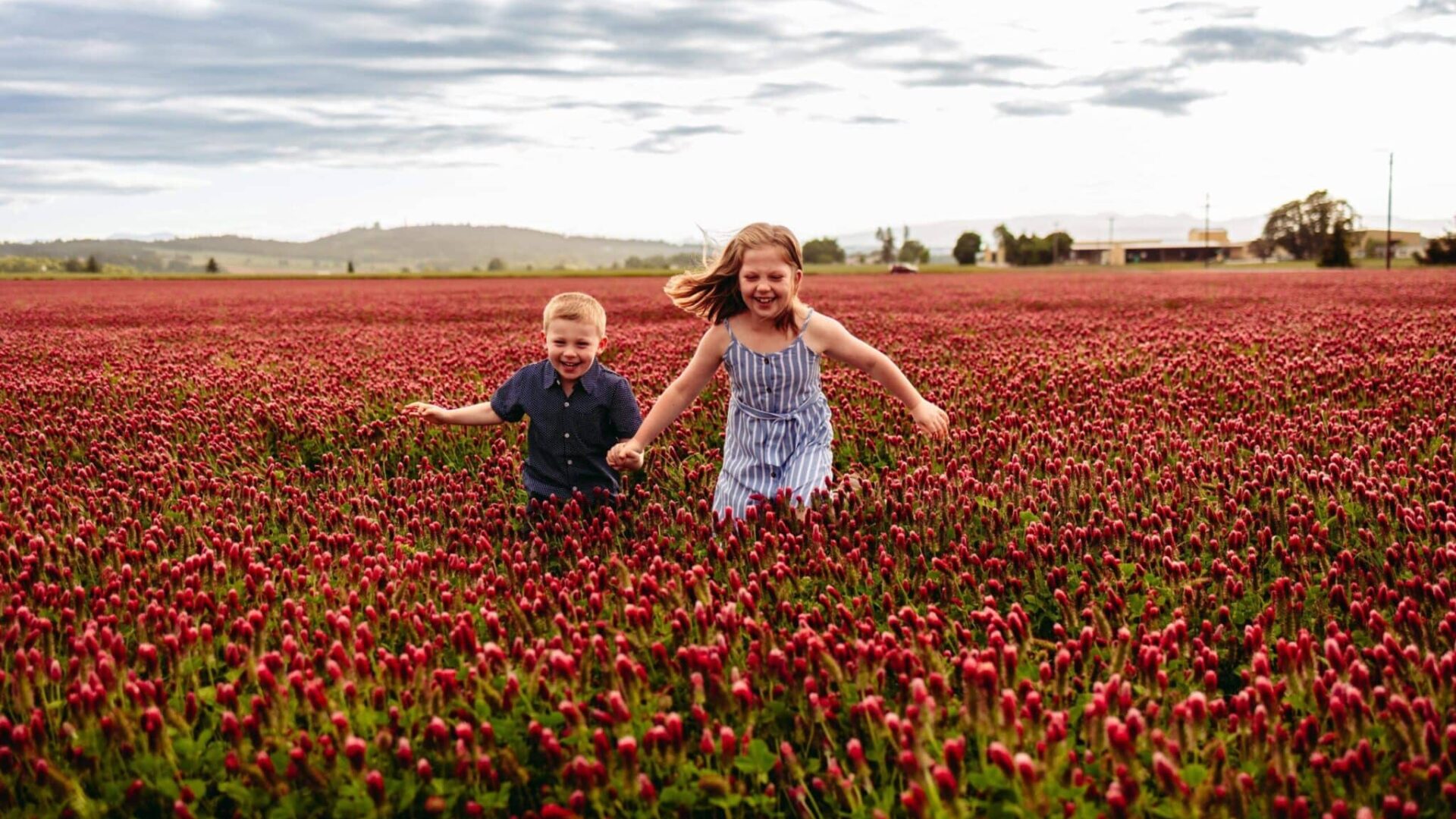 Children running through the Crimson Clover Fields