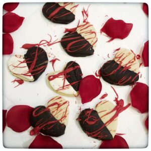 Chocolate Dipped Shortbread Cookies on a white plate 