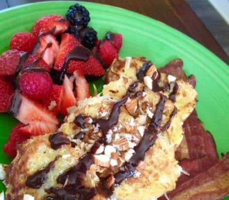 Coconut French Toast with fresh berries on a green plate