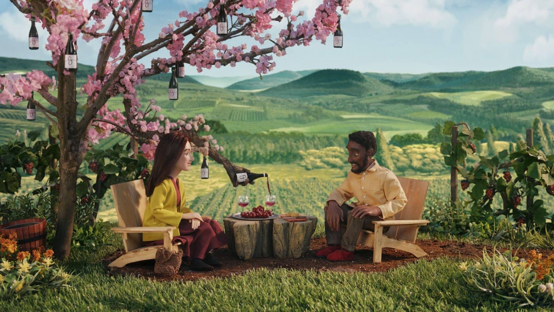 animated image of two people enjoying Oregon wine with a vineyard view