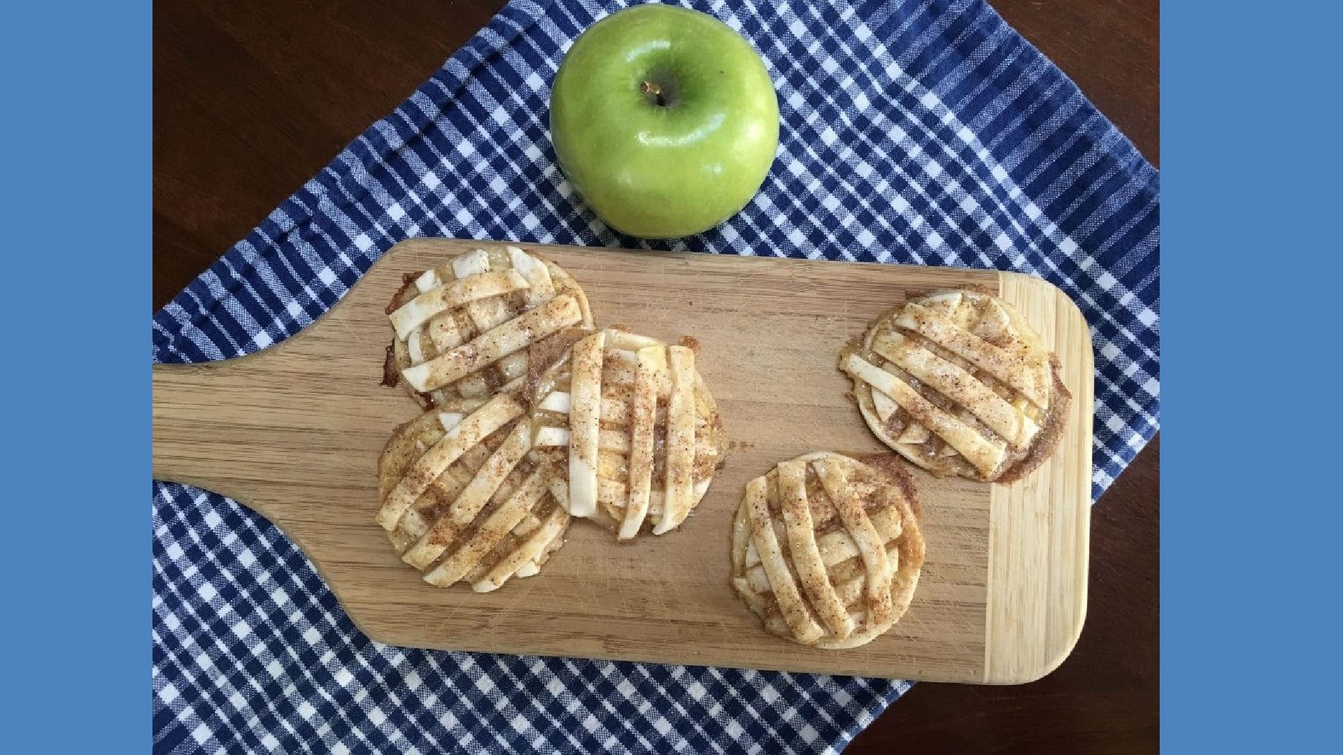 Apple Pie Cookies on a wooden board with a fresh green apple