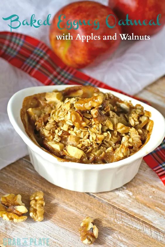 Baked Eggnog Oatmeal in an oval ramekin with fresh walnutss