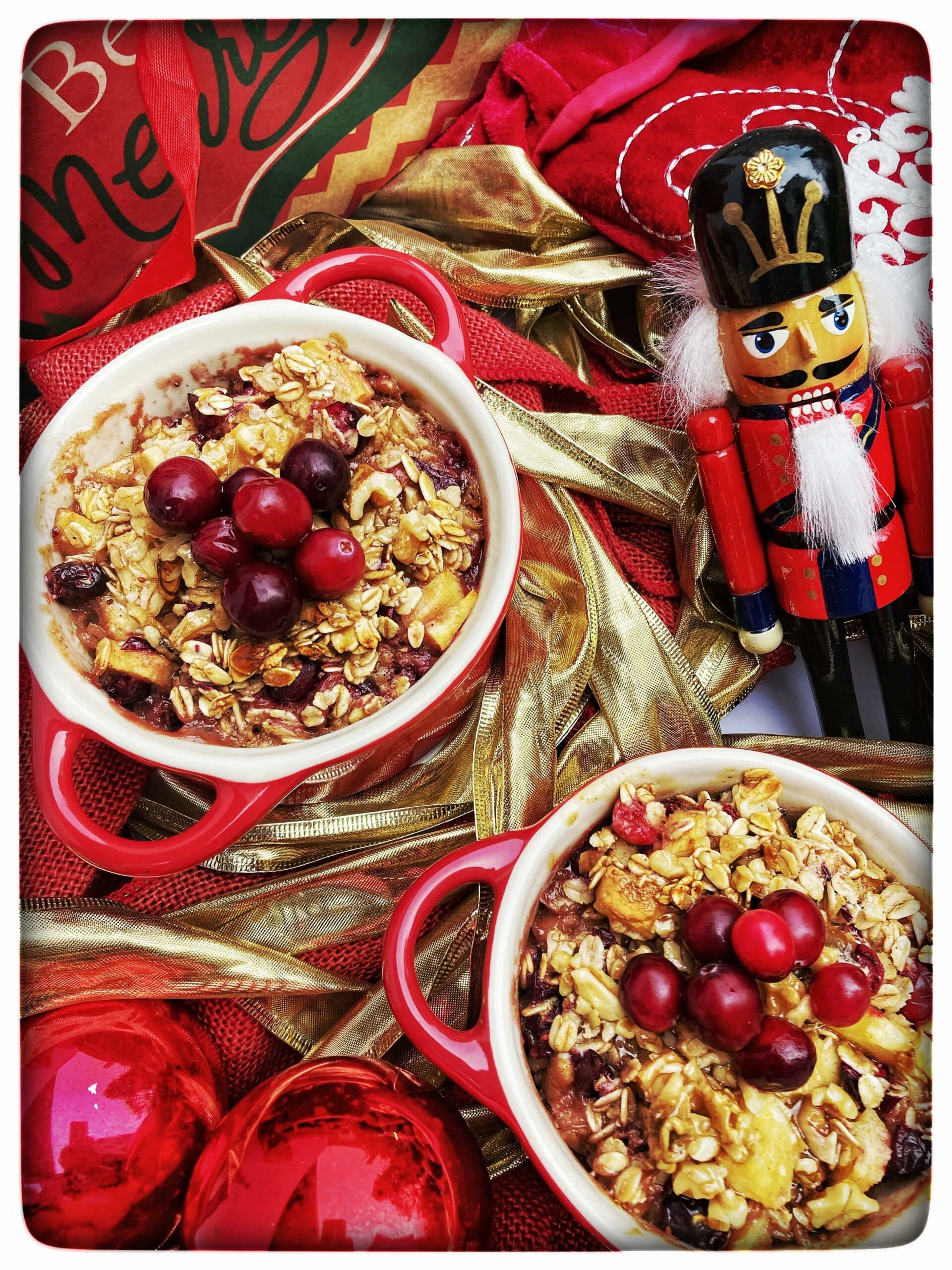 colorful Baked Spiced Oatmeal with Cranberries, Apples and Walnuts and a nutcracker