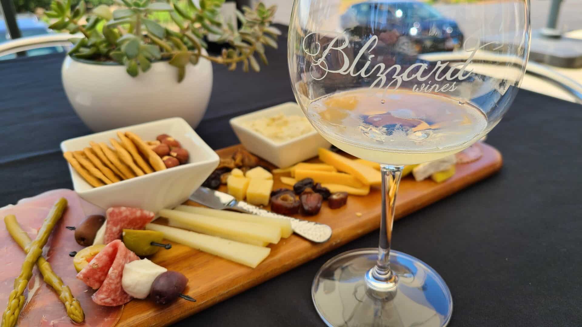 boottle of Blizzard awine nd cheese tasting board