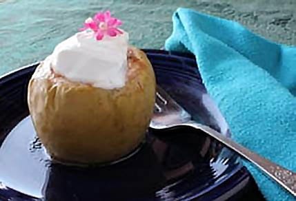 Crustless Apple Pie on dark blue plate with blue napkin