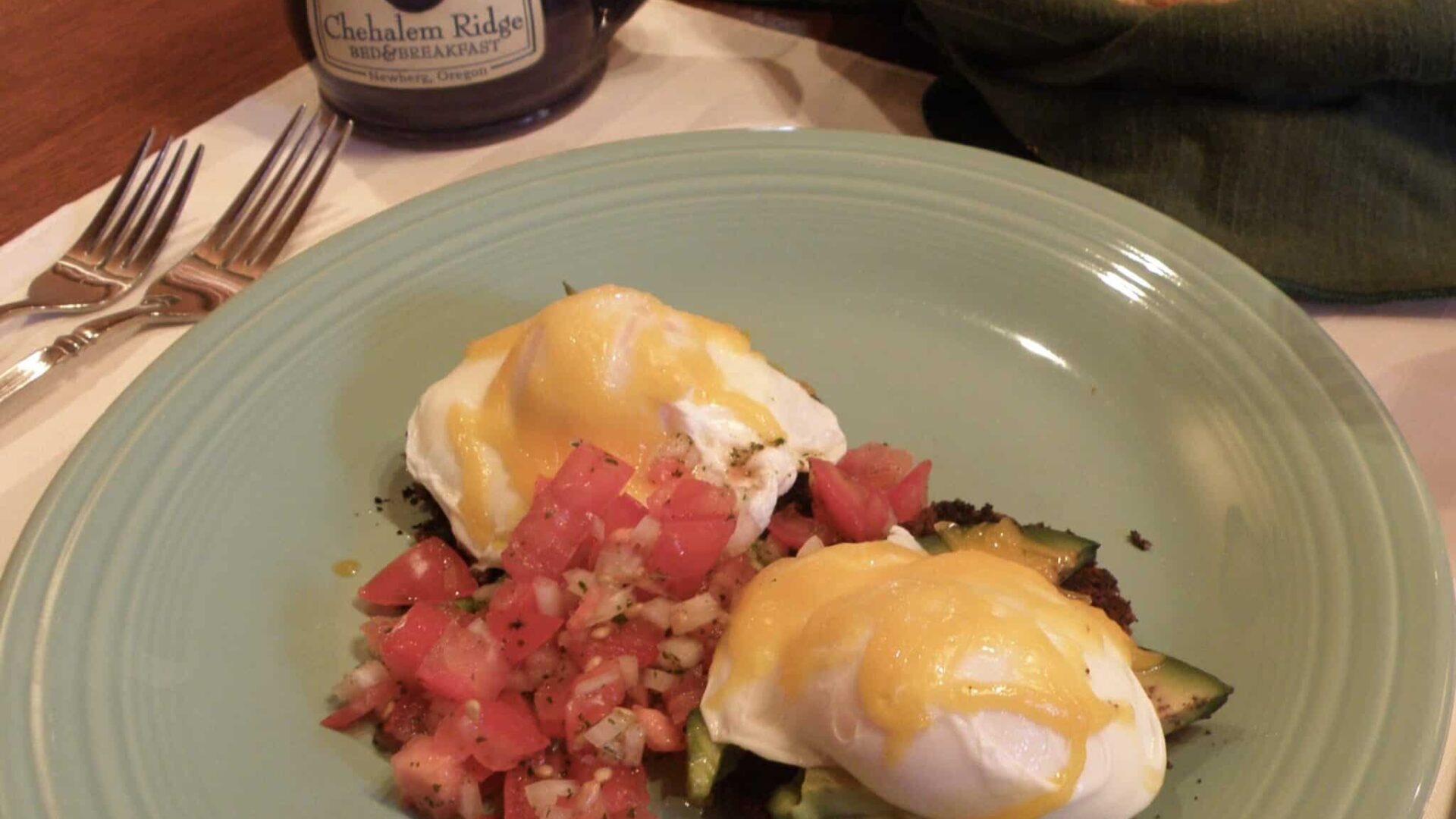 Southwest Eggs Benedict on a green plate at Chehalem Ridge B&B