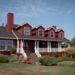 Red building with white trim that is the DreamGiver's Inn Bed and Breakast