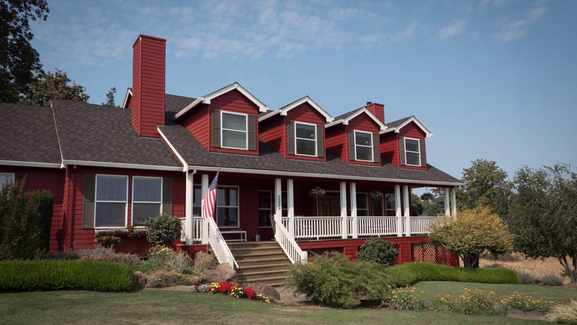 Red building with white trim that is the DreamGiver's Inn Bed and Breakast