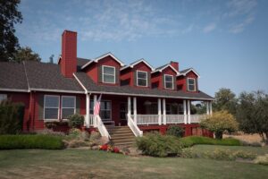 Red building with white trim that is the DreamGiver's Inn Bed and Breakast