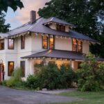 Two story beige house with brown roof and trim. Old Parkdale Inn Bed and Breakfast