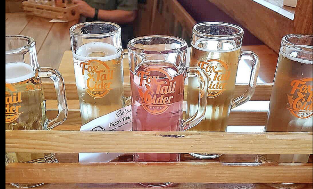 Flight of Fox Tail Cider in wooden server