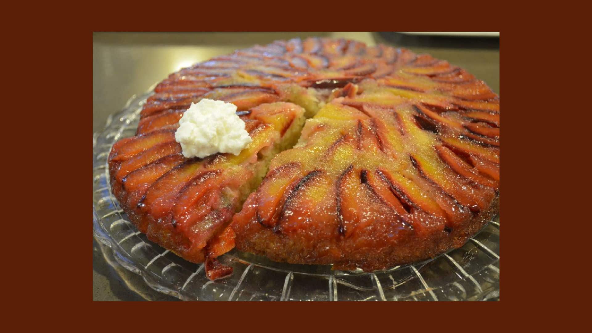 Plum Upside down cake on a round glass platter