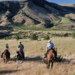 Riders on horseback at Wilson Ranches Retreat
