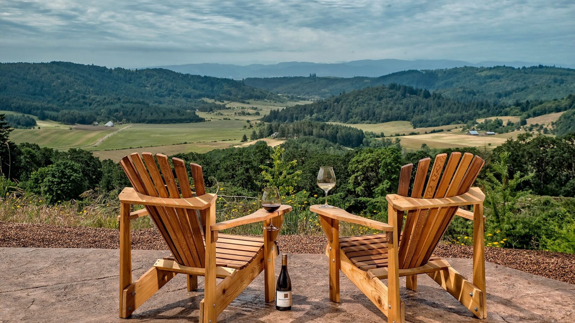 two Adirondack chair overlooking the Willamette Valley