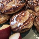 Aebleskivers, fresh apples and a dusting of powdered sugar