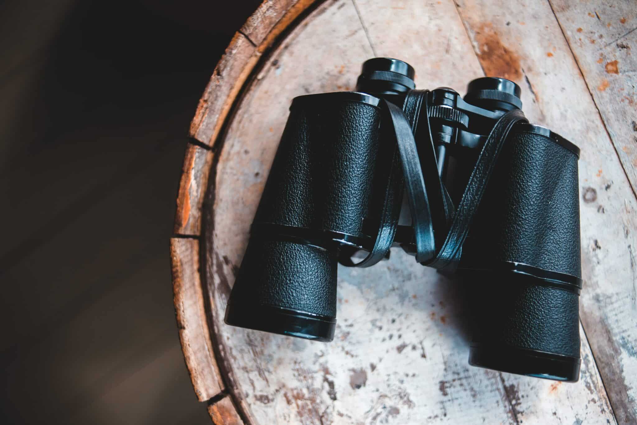 binoculars and a wooden tray