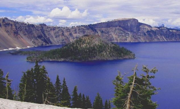 a very blue Crater Lake, Wizard Island and high billowy clouds