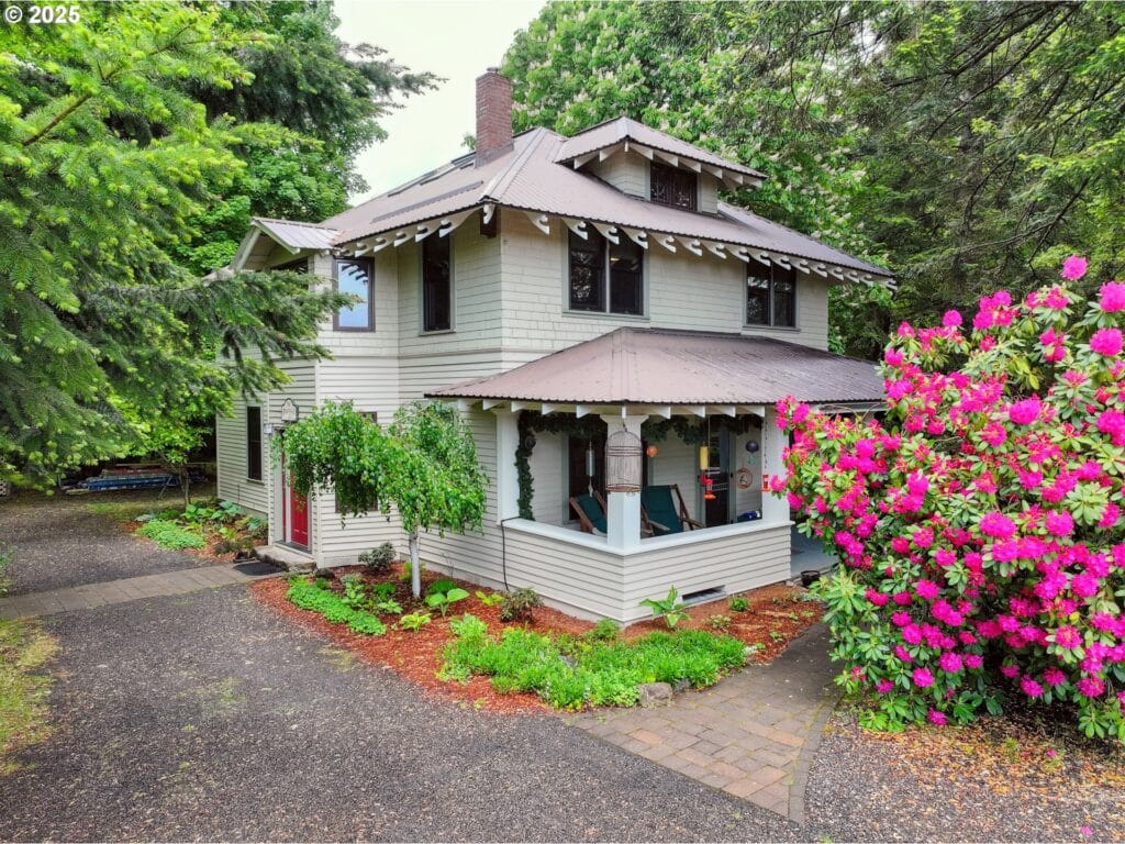 Two story beige house with brown roof and trim. Old Parkdale Inn Bed and Breakfast