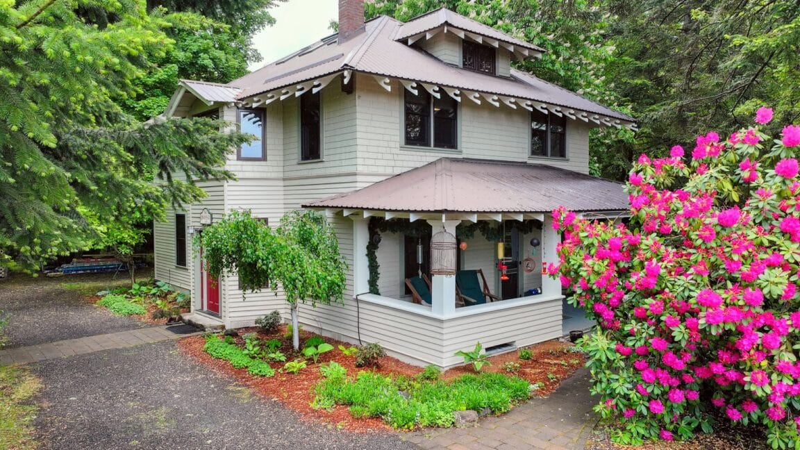 Two story beige house with brown roof and trim. Old Parkdale Inn Bed and Breakfast