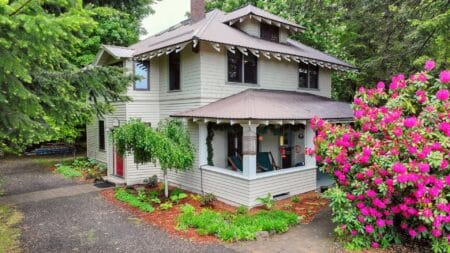 Two story beige house with brown roof and trim. Old Parkdale Inn Bed and Breakfast