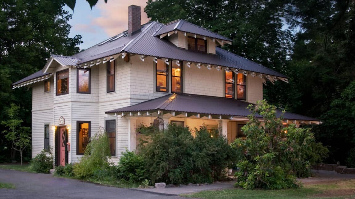 Two story beige house with brown roof and trim. Old Parkdale Inn Bed and Breakfast