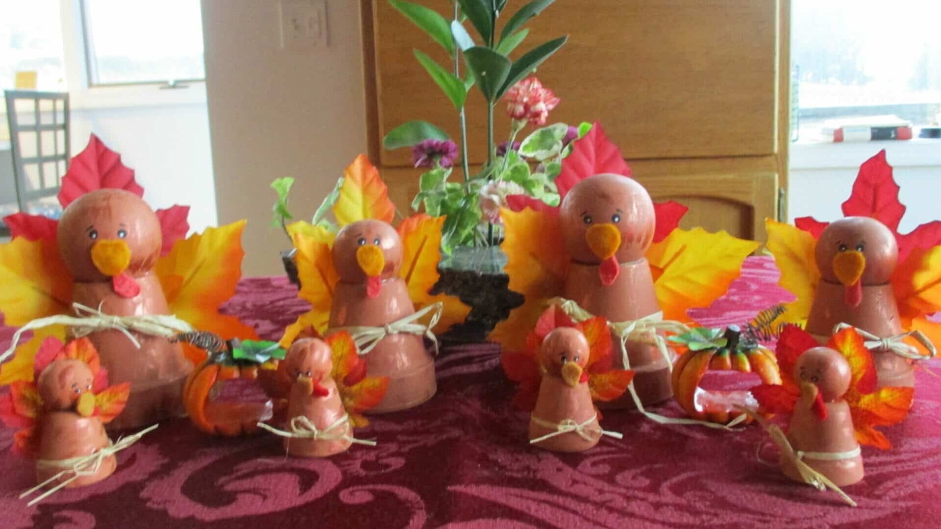 decorative turkey clay pots with orange fall leaves