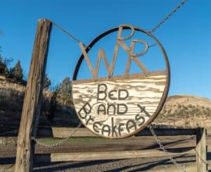 Wilson Ranches Retreat wagon wheel sign
